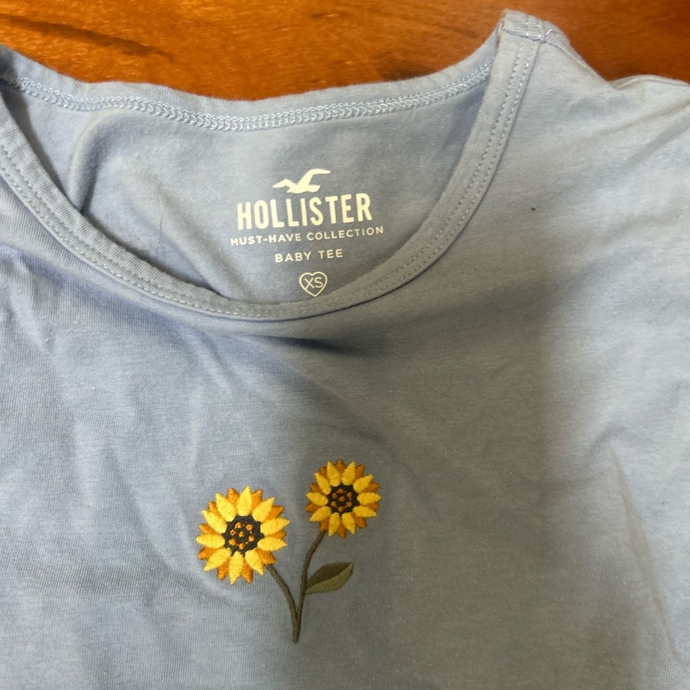 Hollister Light Blue Tee with Sunflower Design